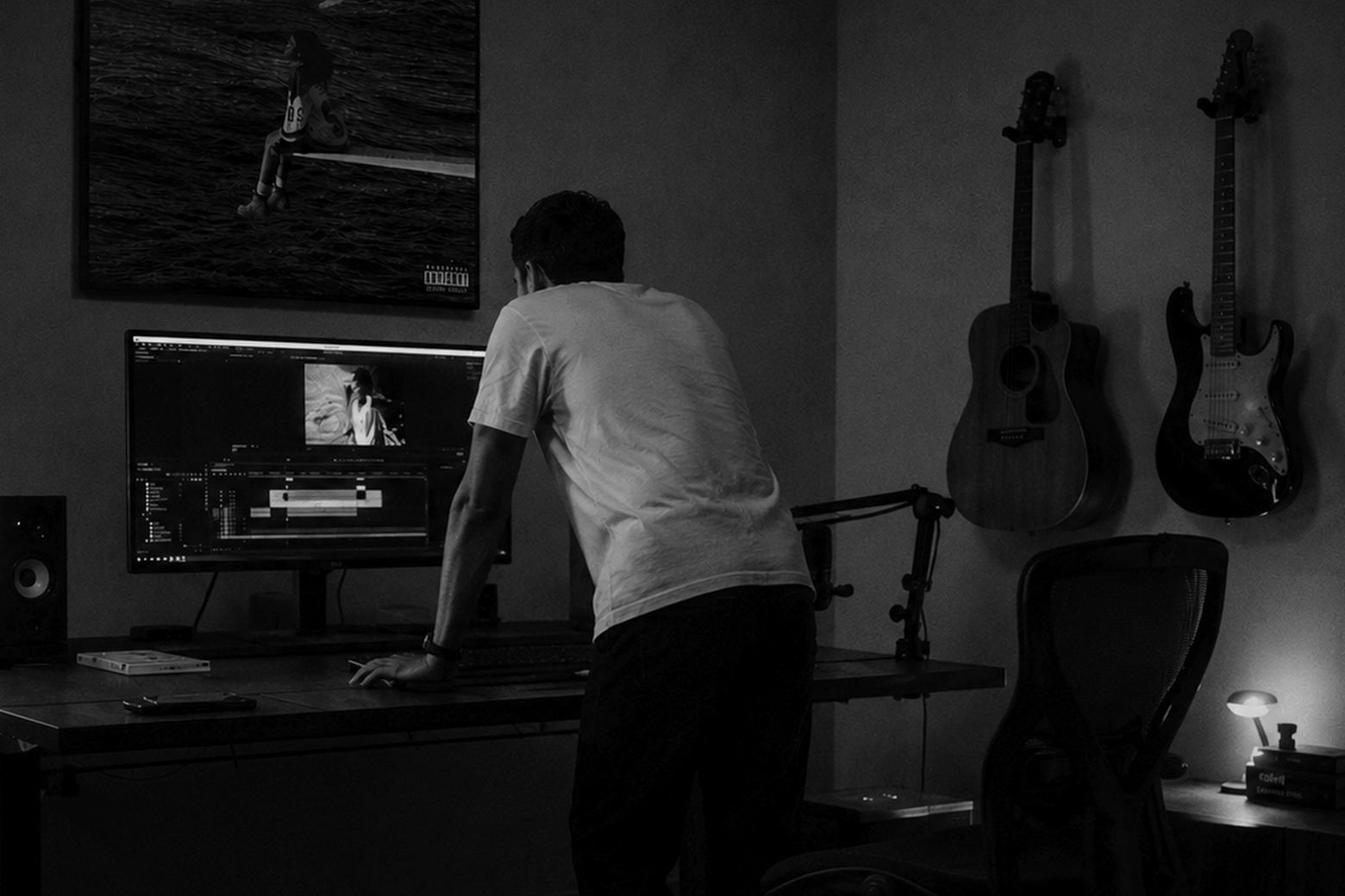 A Manzar engineer standing at a workstation late in the edit suite
